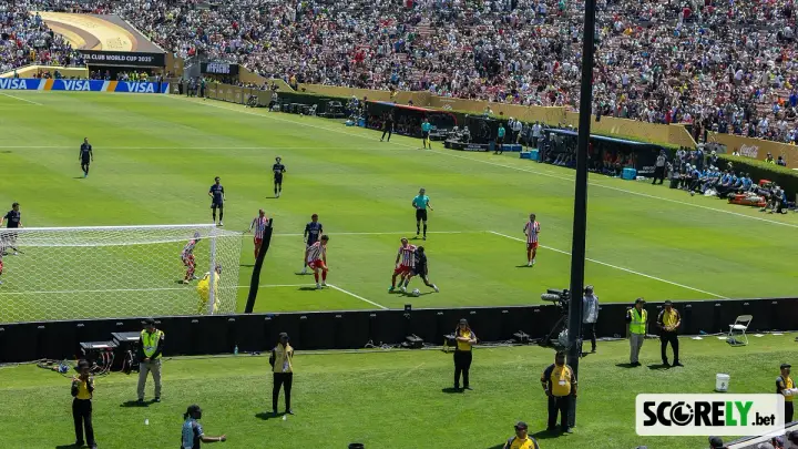 Soccer match in a crowded stadium with players near the goal (file photo)